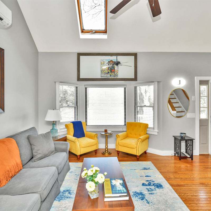 living room with two yellow chairs