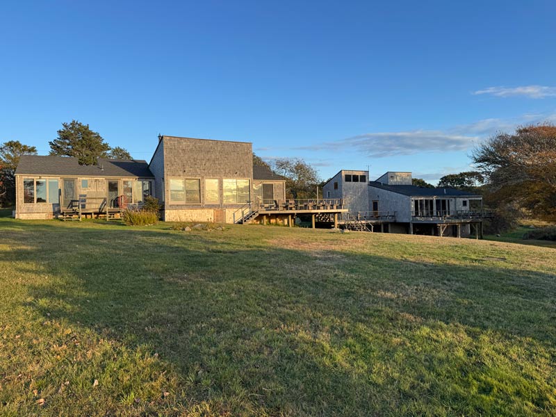 modern home with large windows and wooden deck