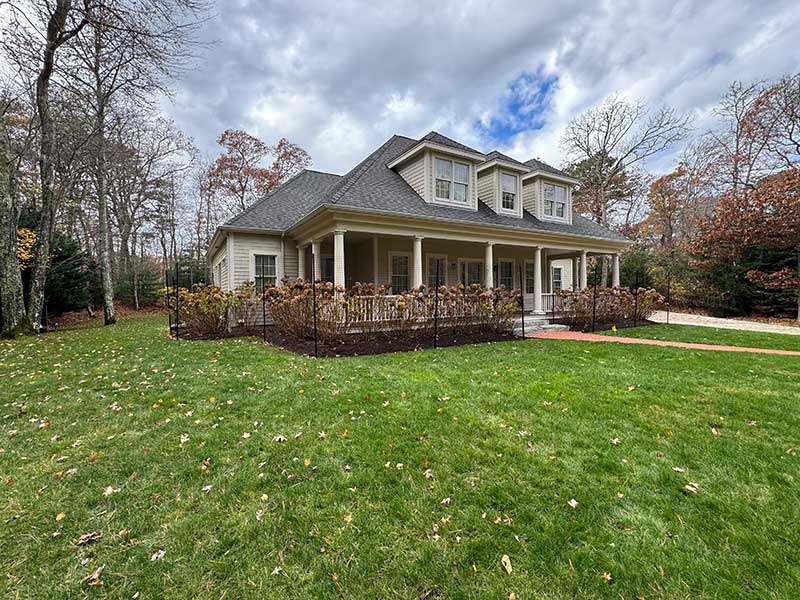 a house surrounded by a green lawn